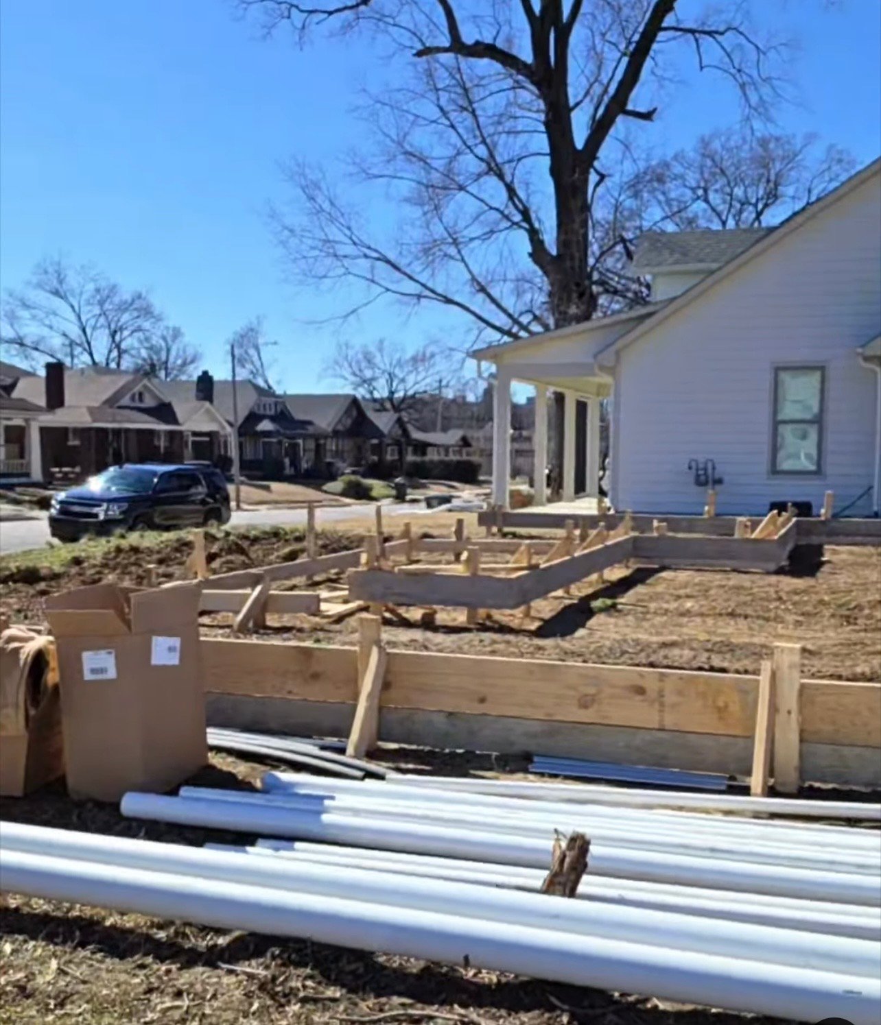 Foundation forms with PVC rough-in — site ready for pour