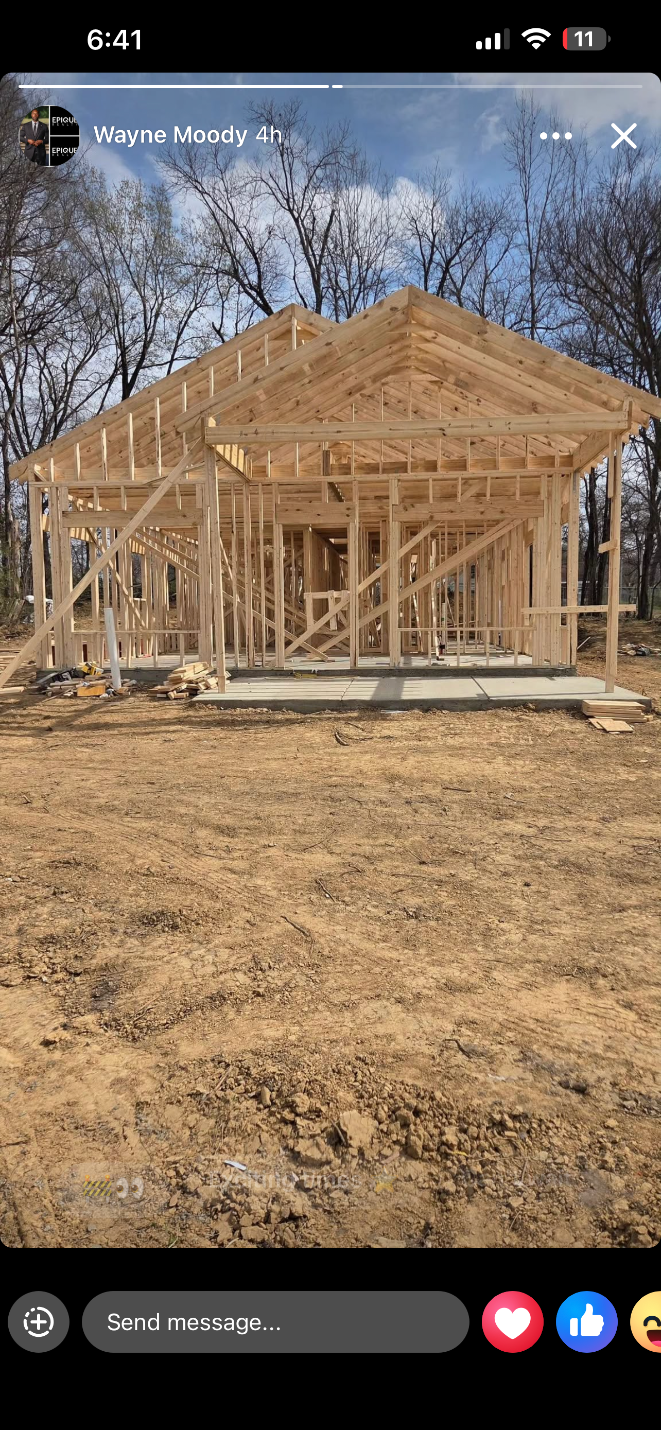 Wide shot of the completed frame — roof trusses installed