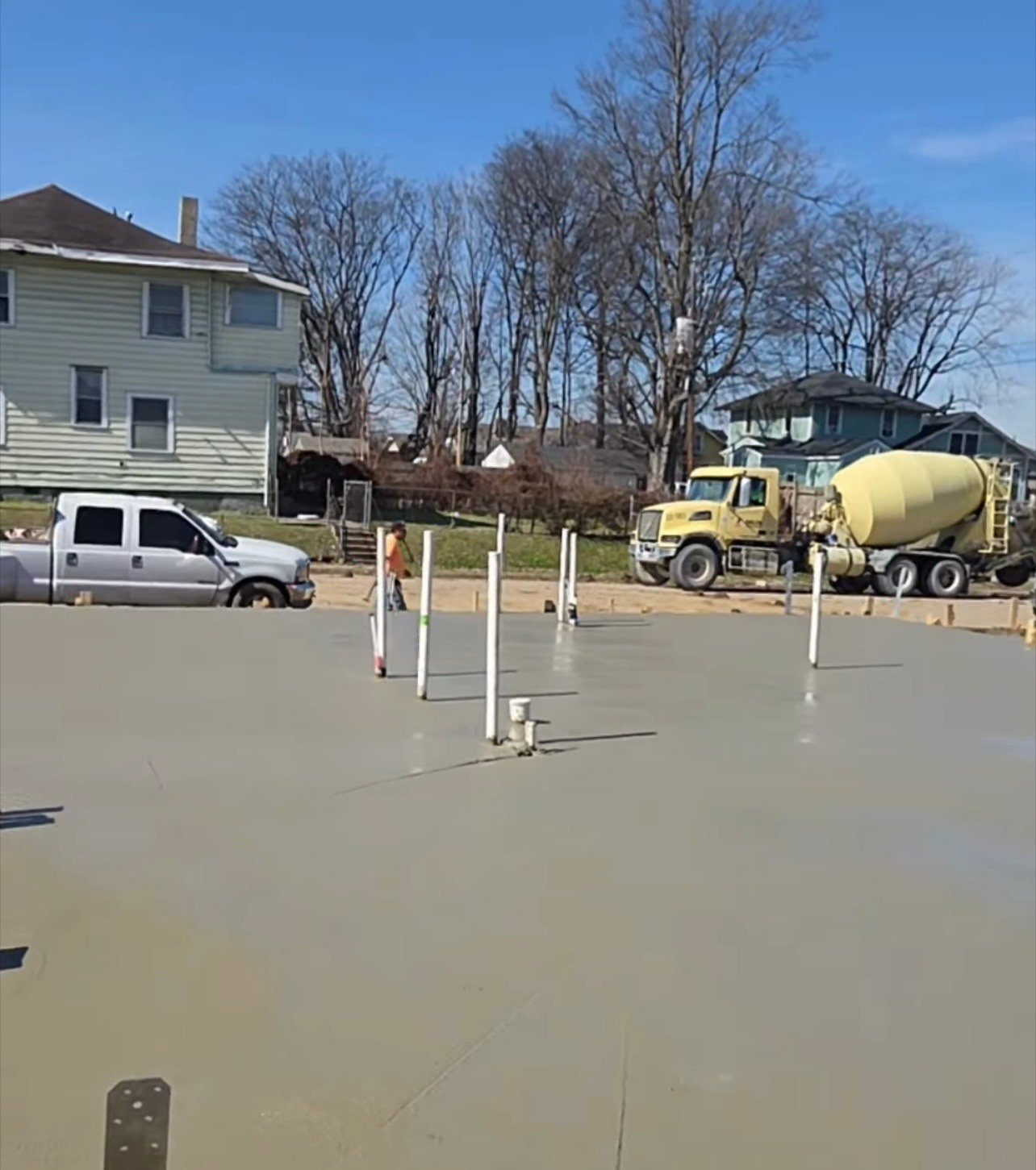 Concrete mixer truck delivers the slab pour