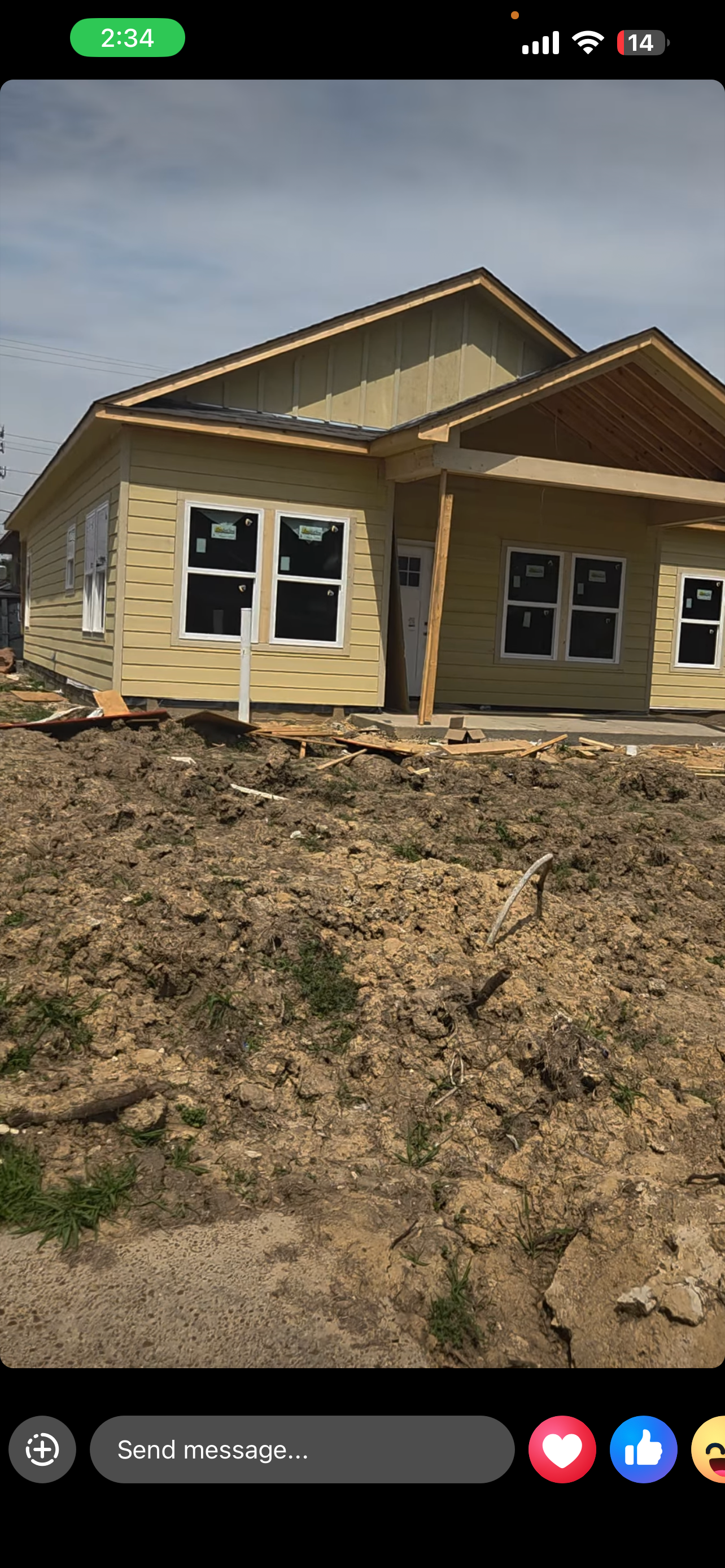 Porch and entry door — gray siding and board-and-batten detail