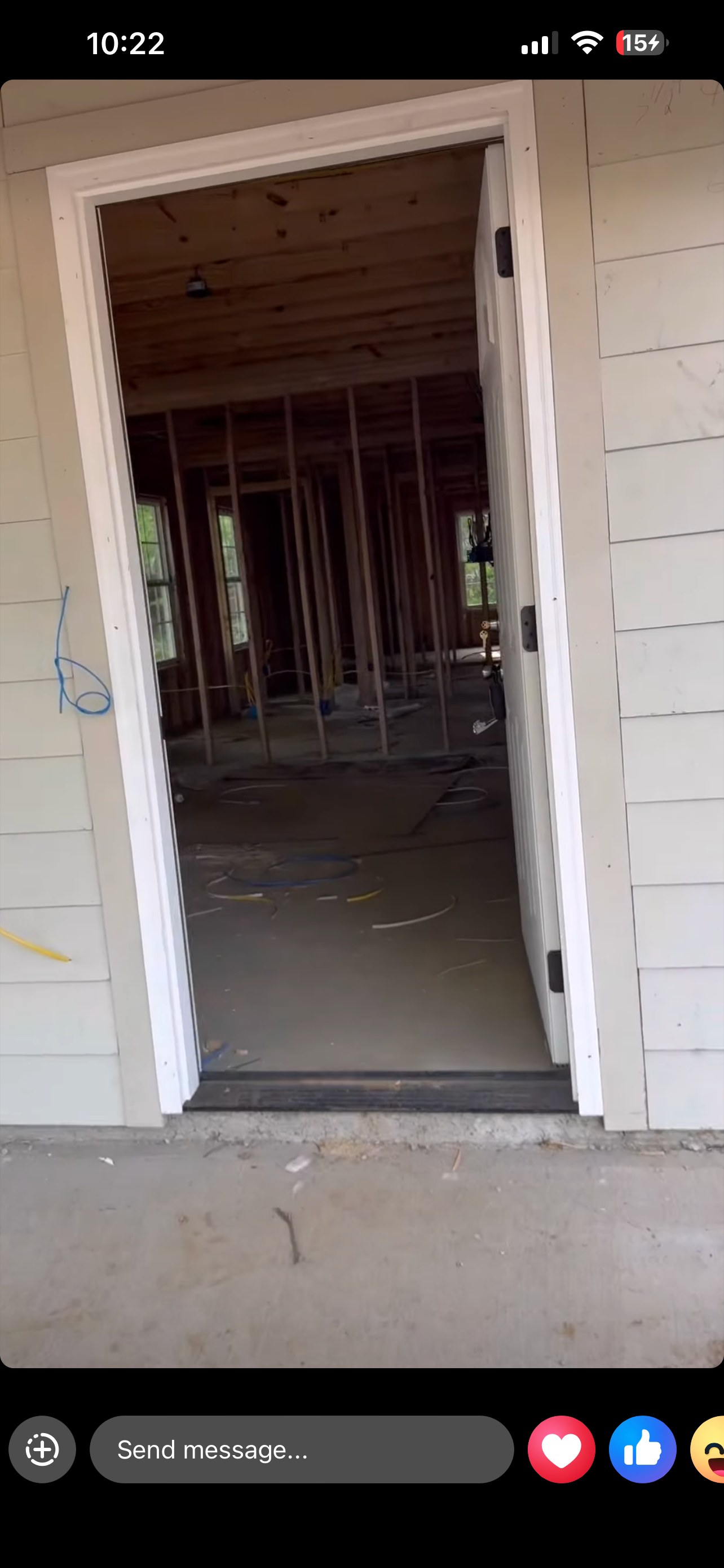 View through the front door — interior framing and subfloor